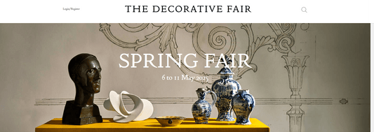 Spring Fair exhibition at The Decorative Fair featuring artistic sculptures and blue patterned vases display