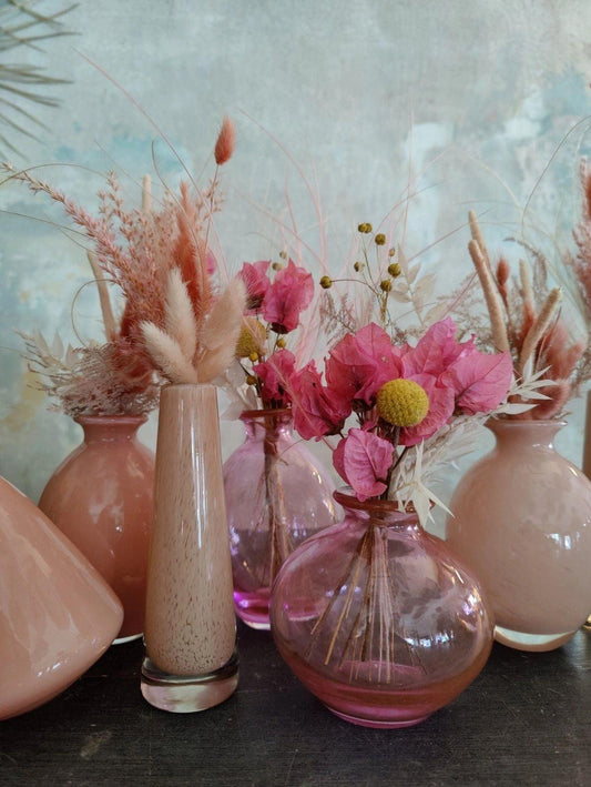 Quality mouthblown glass vases from DutZ Collection with floral arrangements on display
