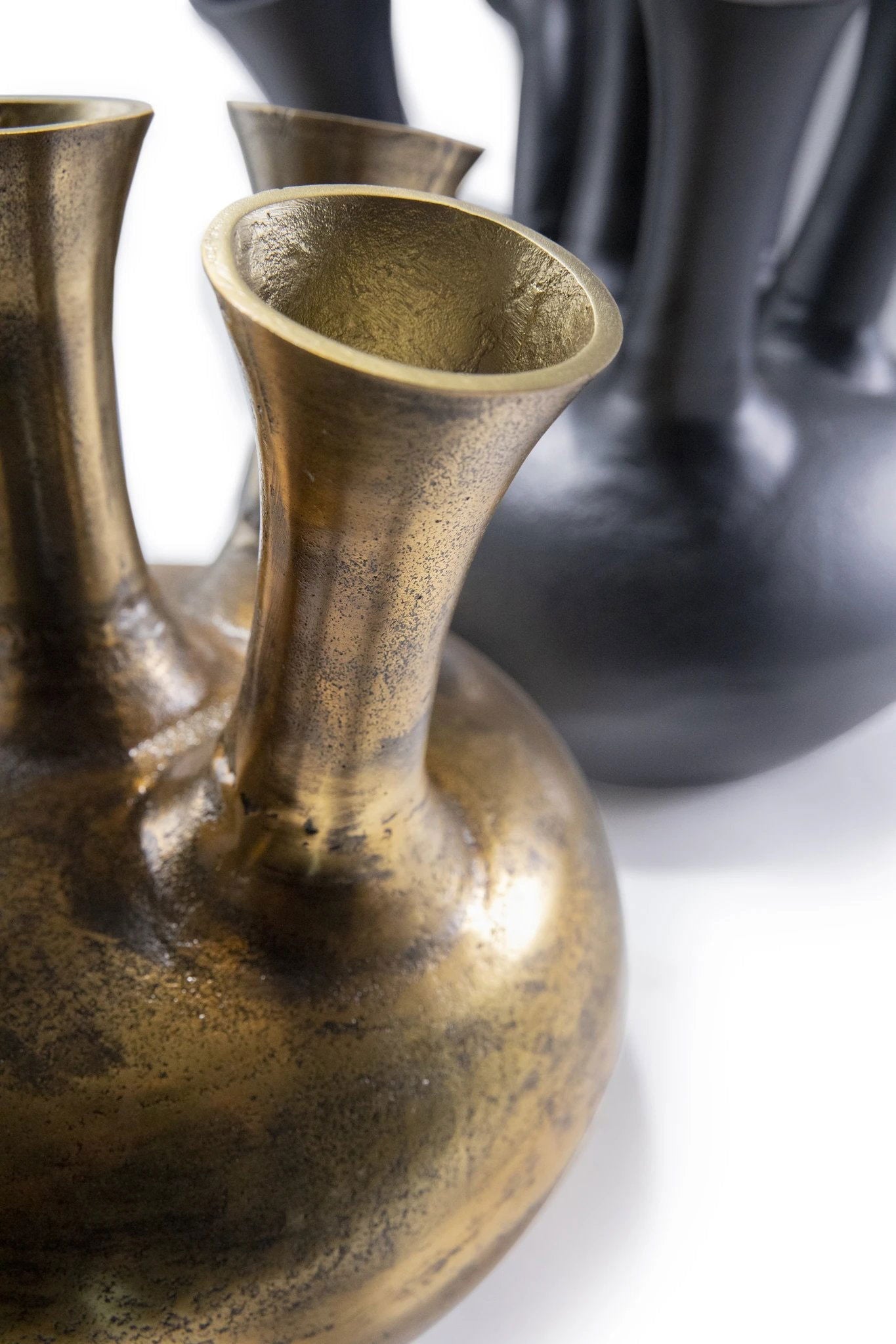 Lowlands Design artistic vase bronze with textured surface and elegant flared neck