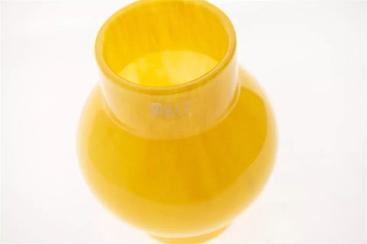 Yellow glass vase by Lowlands Design with a smooth glossy finish and wide opening