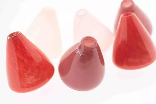 Lowlands Design tumbling vase set featuring red and pink conical glass vases with a modern aesthetic