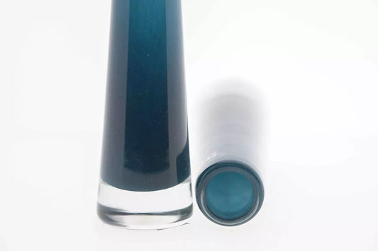 Lowlands Design Solifleur tall blue glass budvase with clear base shown upright and lying down