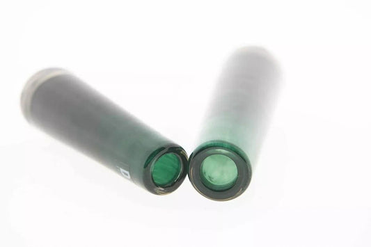 Lowlands Design green glass solifleur budvase shown lying on white background