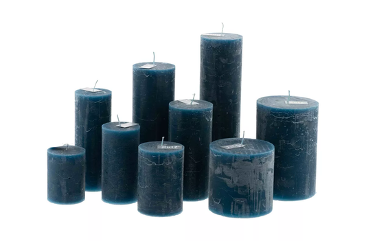 Set of nine dark blue candles of varied heights and sizes by Lowlands Design