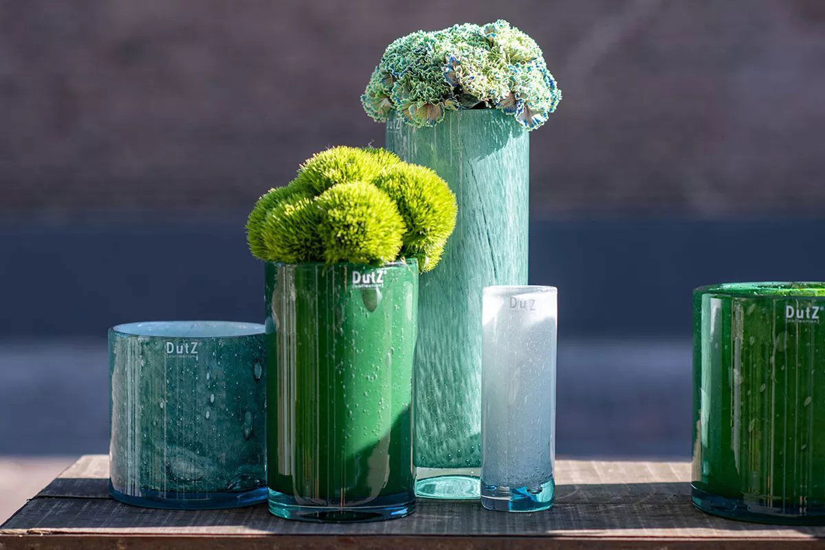 Lowlands Design cylinder vase collection in various green and blue shades with floral decorations