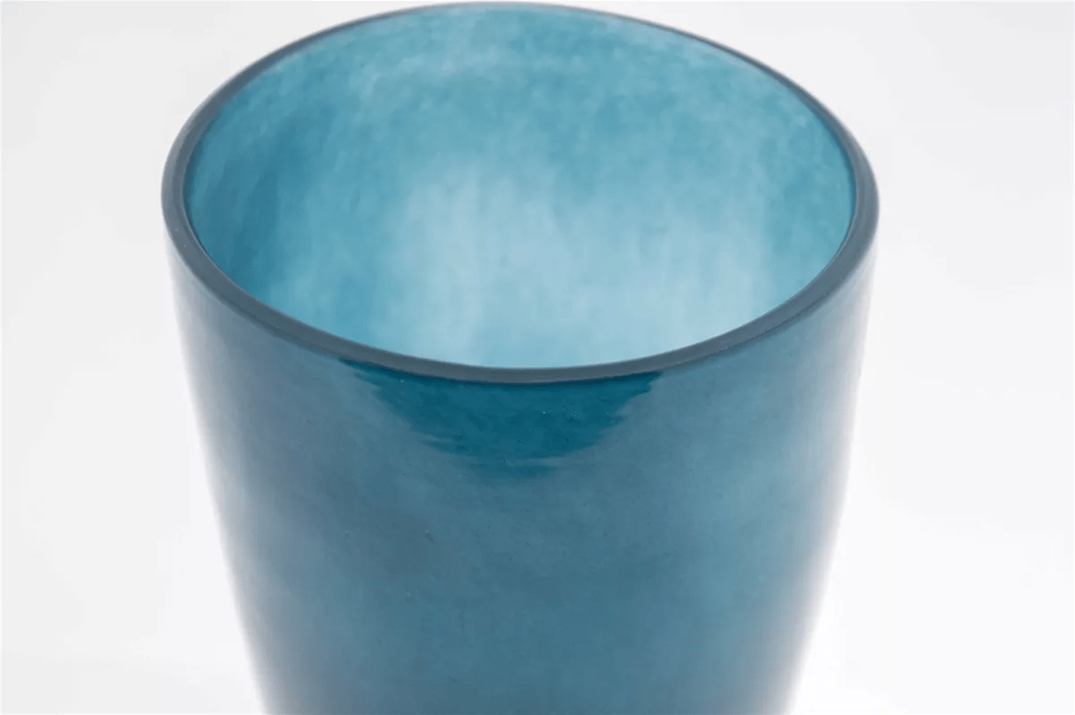 Blue glass flowervase by Lowlands Design with smooth curved surface and glossy finish