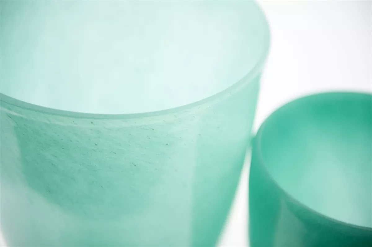 Lowlands Design translucent green flowervase with smooth curved edges shown close up