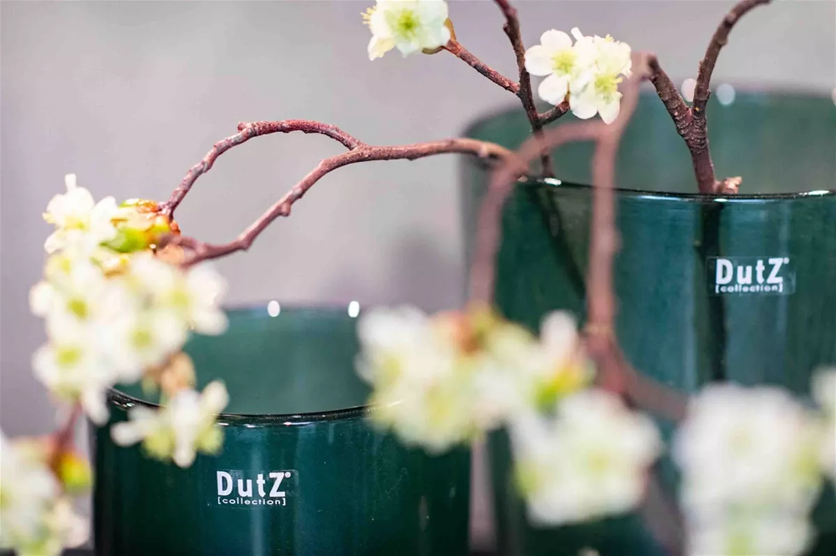 Lowlands Design green glass flowervase with delicate white flowers and branches inside