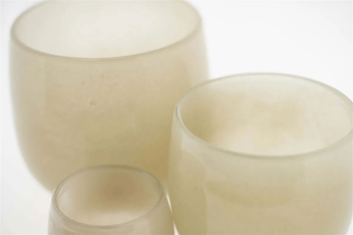 Set of three Lowlands Design glass pots in neutral tones with smooth rounded shapes
