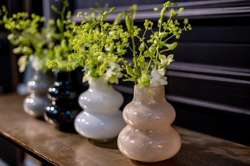 Lowlands Design green glass vase decorative trio of bulbous glass vases with fresh green foliage
