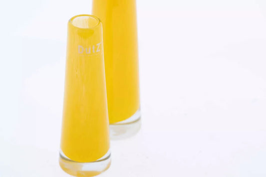 Yellow glass solifleur vase by Lowlands Design with a sleek modern shape for single-stem flowers