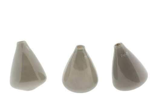 Lowlands Design beige ceramic tumbling vase set with unique tilted shapes for modern decor