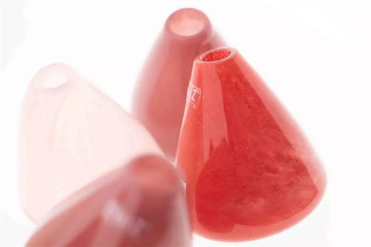 Lowlands Design red and pink tumbling vase with unique slanted cone shapes and smooth finish