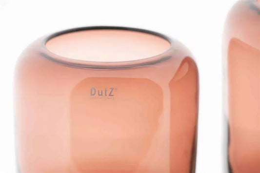 Close-up of a smooth brown Lowlands Design vase with rounded edges and a wide opening