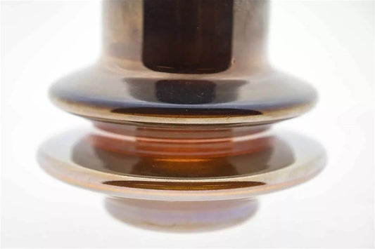 Close-up of Lowlands Design brown glass vase with layered circular base design