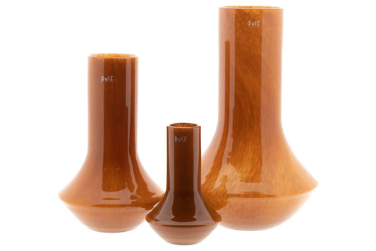 Set of three brown glass vases by Lowlands Design with glossy finish and varied shapes