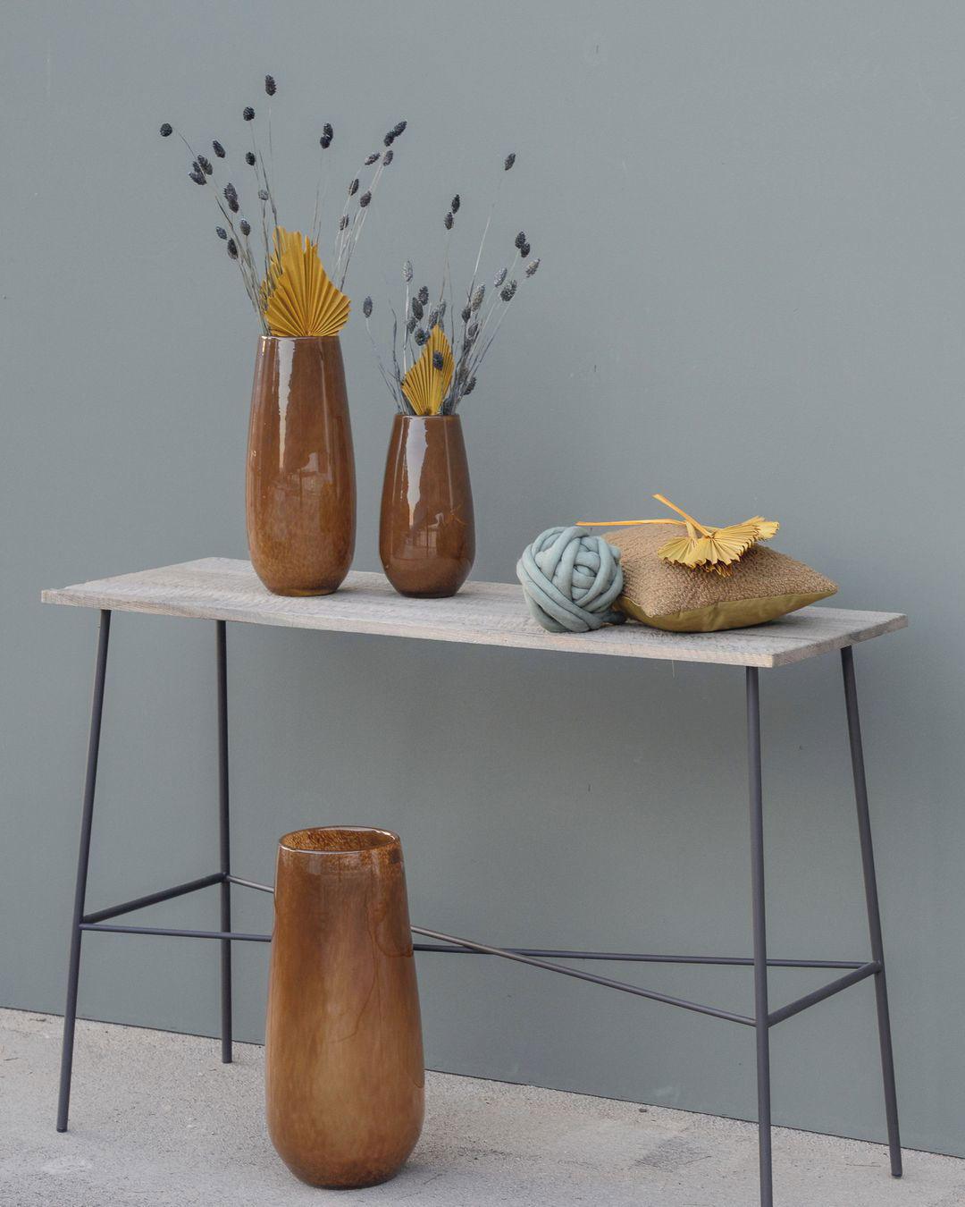 Lowlands Design brown ceramic vase flower set with dried yellow and gray floral accents on a modern table