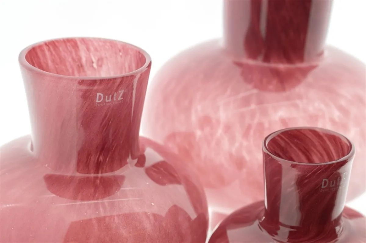 Lowlands Design red glass vase with a glossy finish showcasing elegant rounded shapes