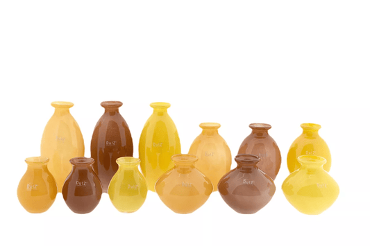 Lowlands Design vase set with twelve ceramic vases in yellow, brown, and orange tones for home decor