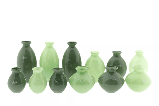 Lowlands Design green ceramic vase set with varying shapes and sizes for decorative use