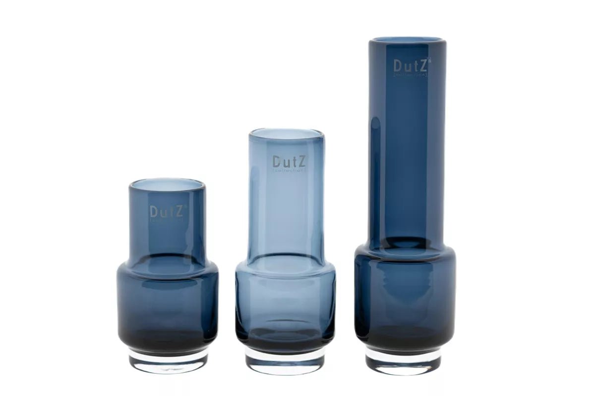 Set of three Lowlands Design blue glass vases in varying heights and modern cylindrical shapes