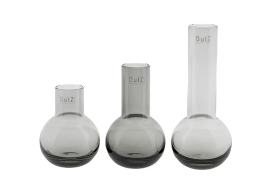 Lowlands Design set of three modern gray glass vases with rounded bases and cylindrical necks