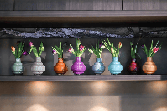 Lowlands Design colorful vase small collection displayed on shelf with fresh tulips inside
