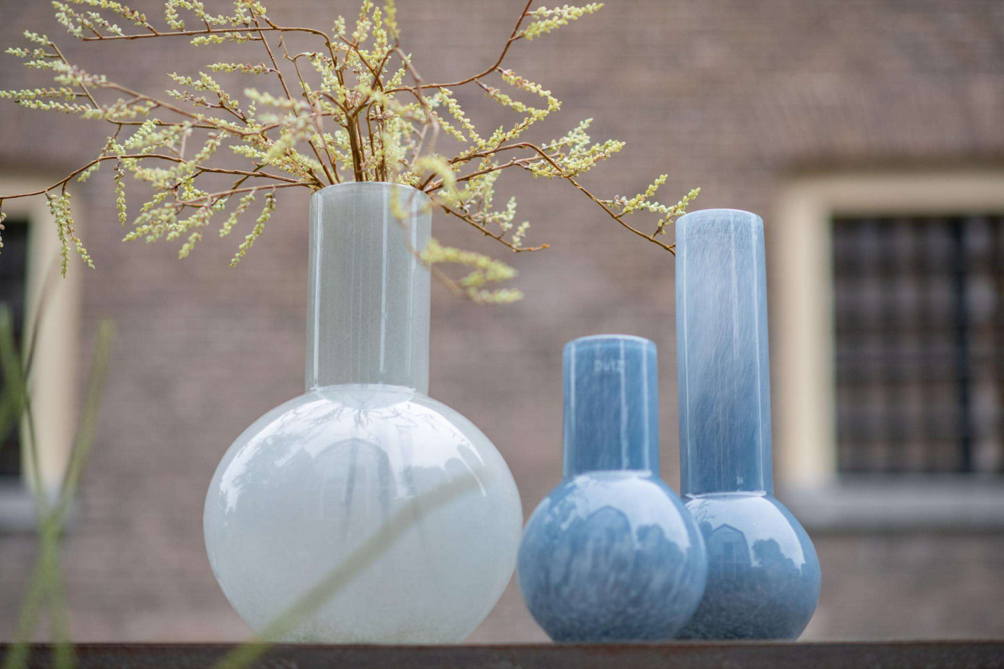 Lowlands Design flowervase glass grey with elegant design, showcasing decorative stems