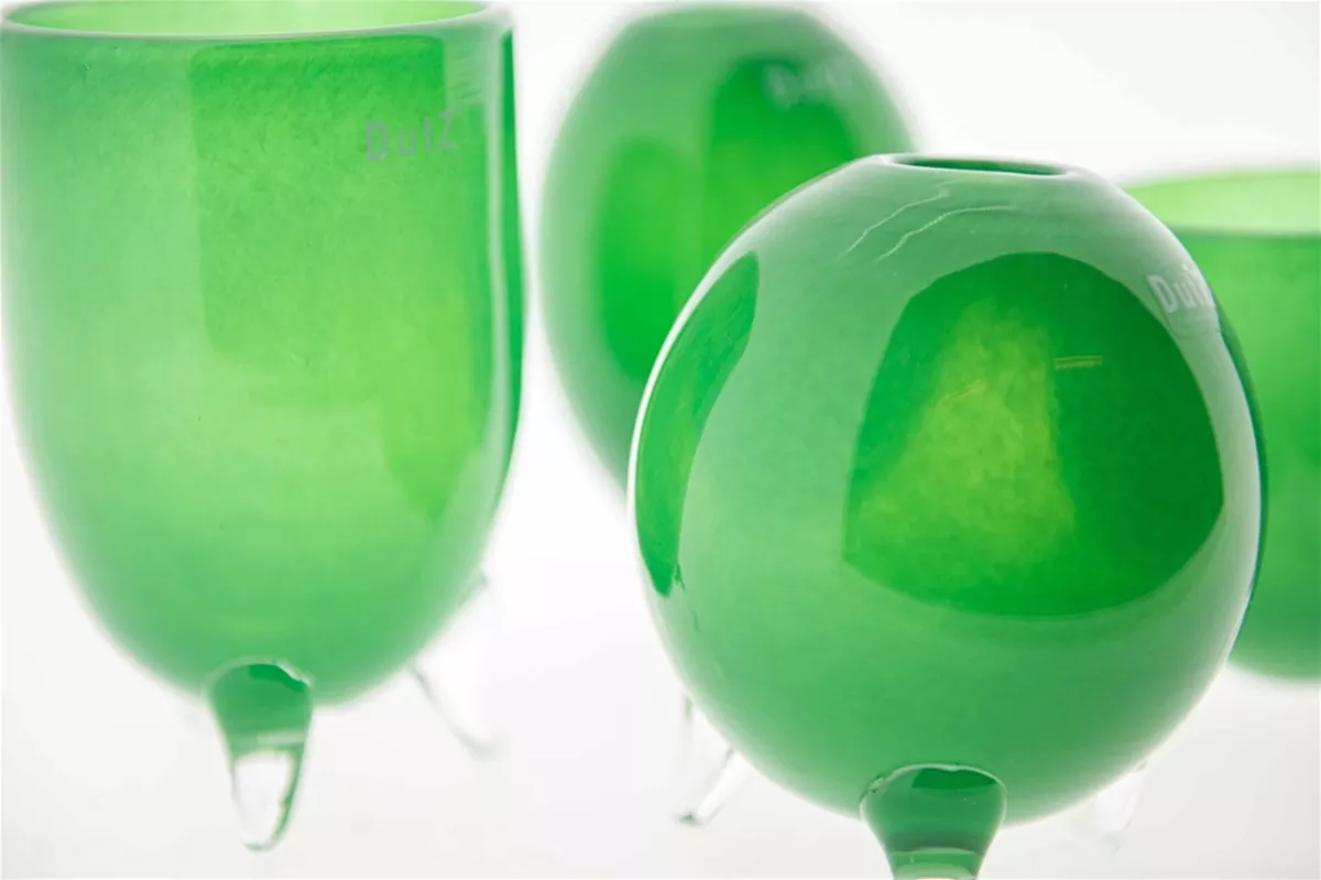 Lowlands Design green vase set glass feet with rounded shapes and translucent finish