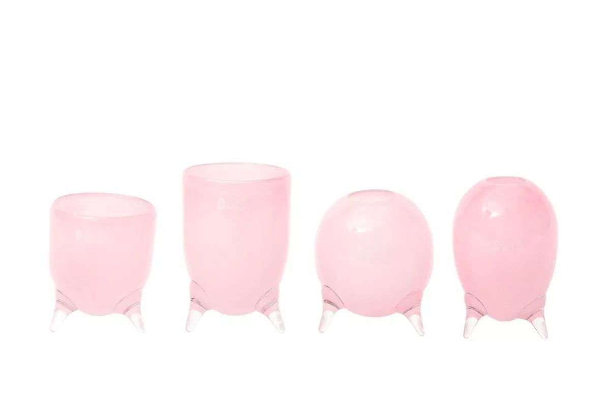 Lowlands Design pink vase set glass feet with four unique shaped decorative glass vases