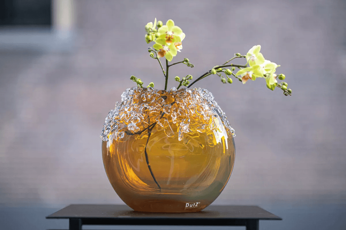 Award winning Bumpy vase from DutZ Collection with intricate glass design and delicate yellow flowers