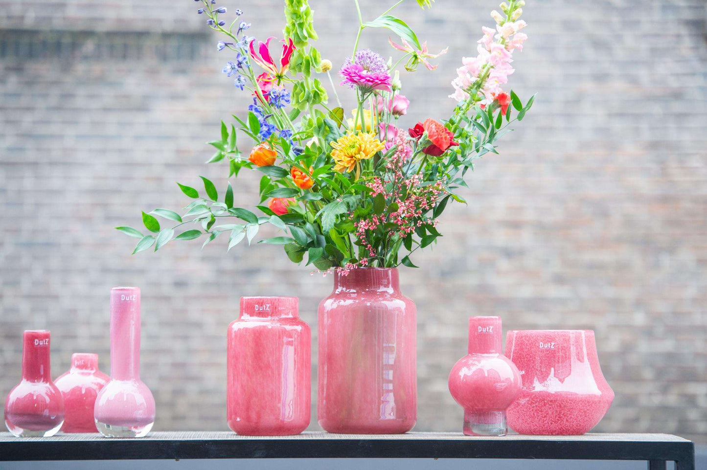 Lowlands Design Apothecary Glass Vase Collection in Pink with Colourful Floral Arrangements