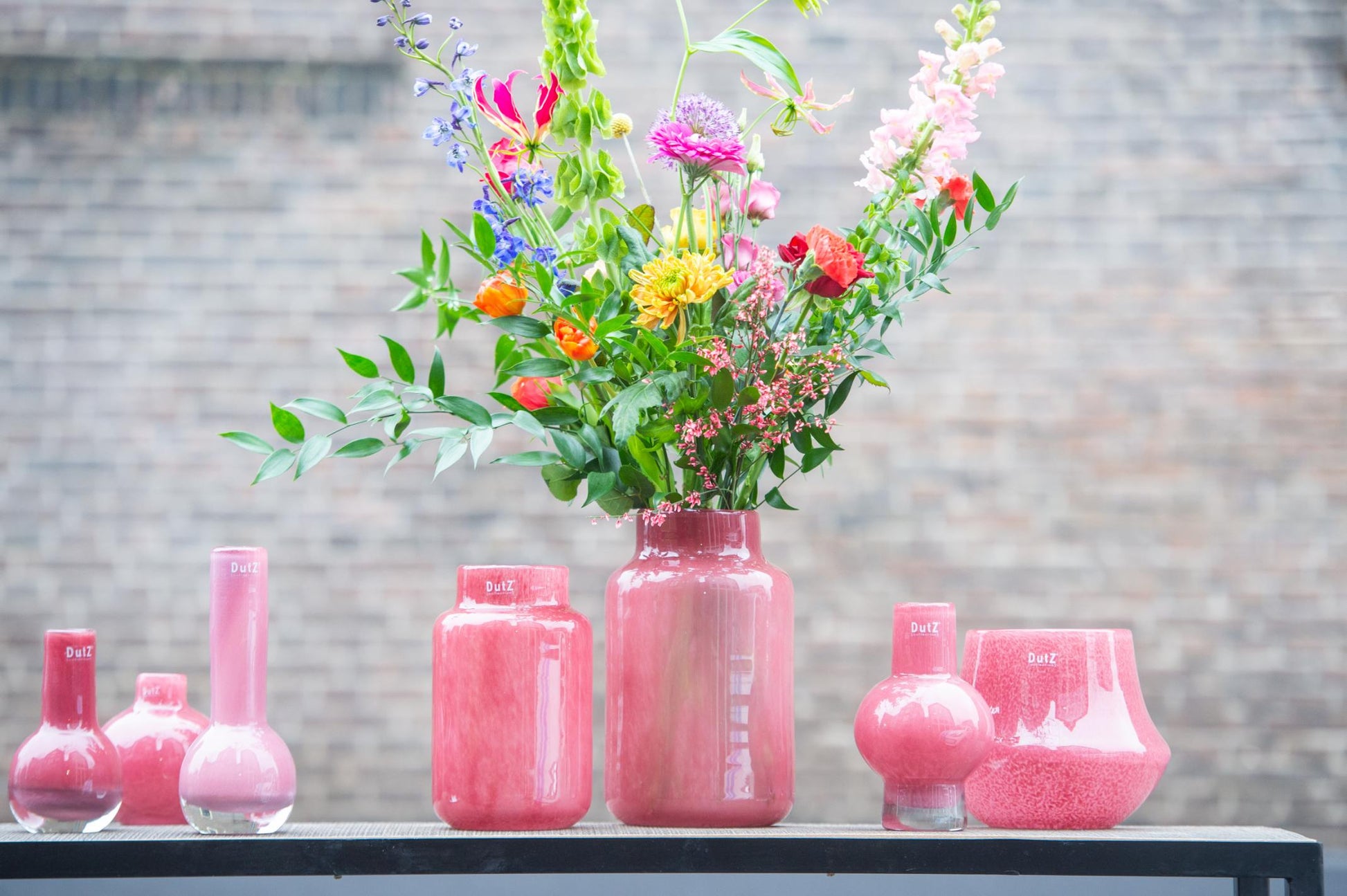 Lowlands Design Apothecary Glass Vase Collection in Pink with Colourful Floral Arrangements