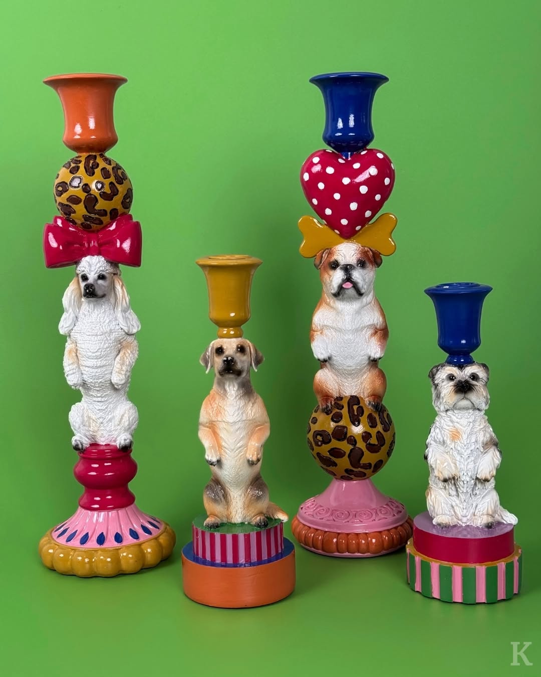 Set of four vintage dog candleholders in colourful designs, each showcasing different dog breeds