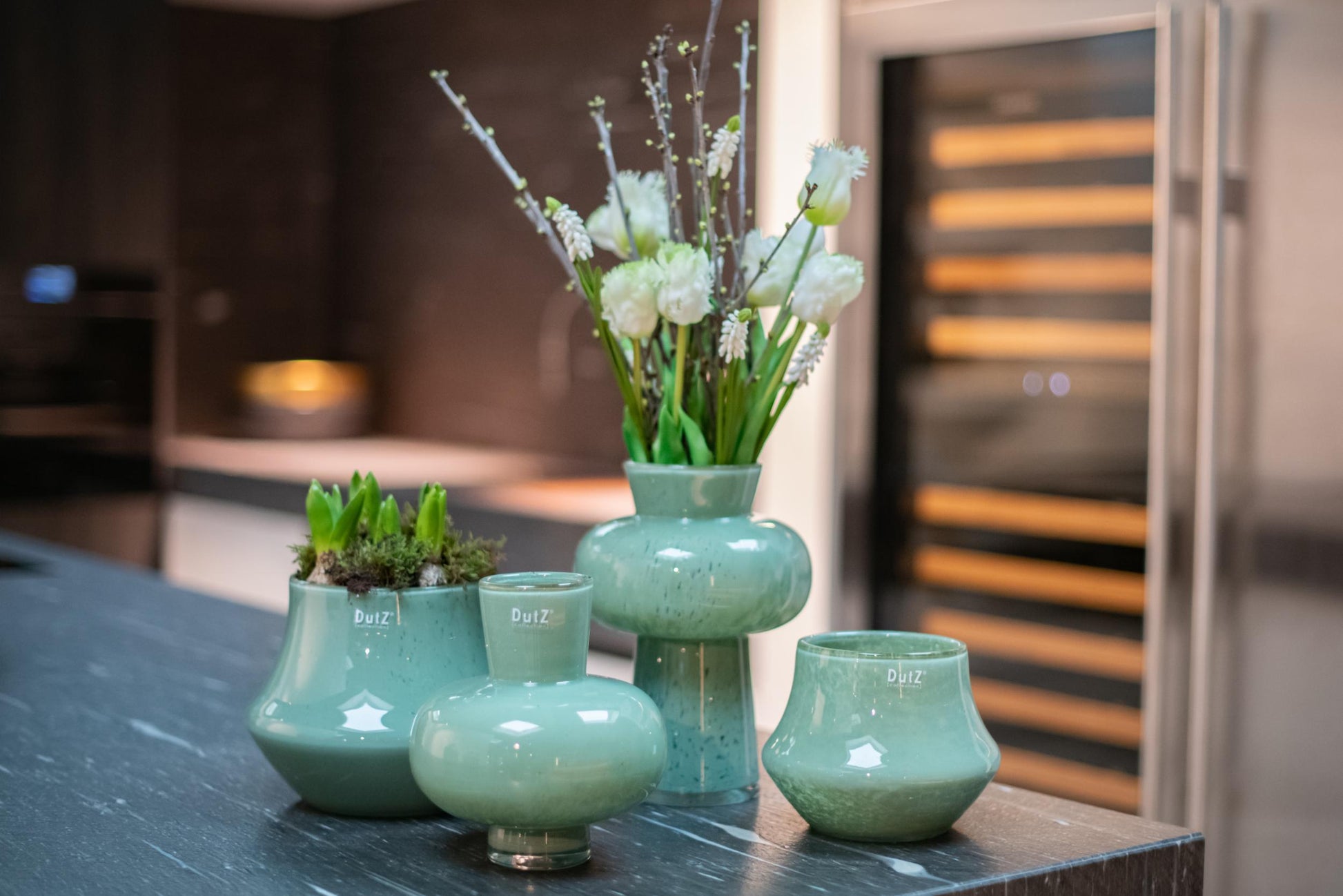 Lowlands Design mouthblown vase collection in soft green with stylish floral arrangements