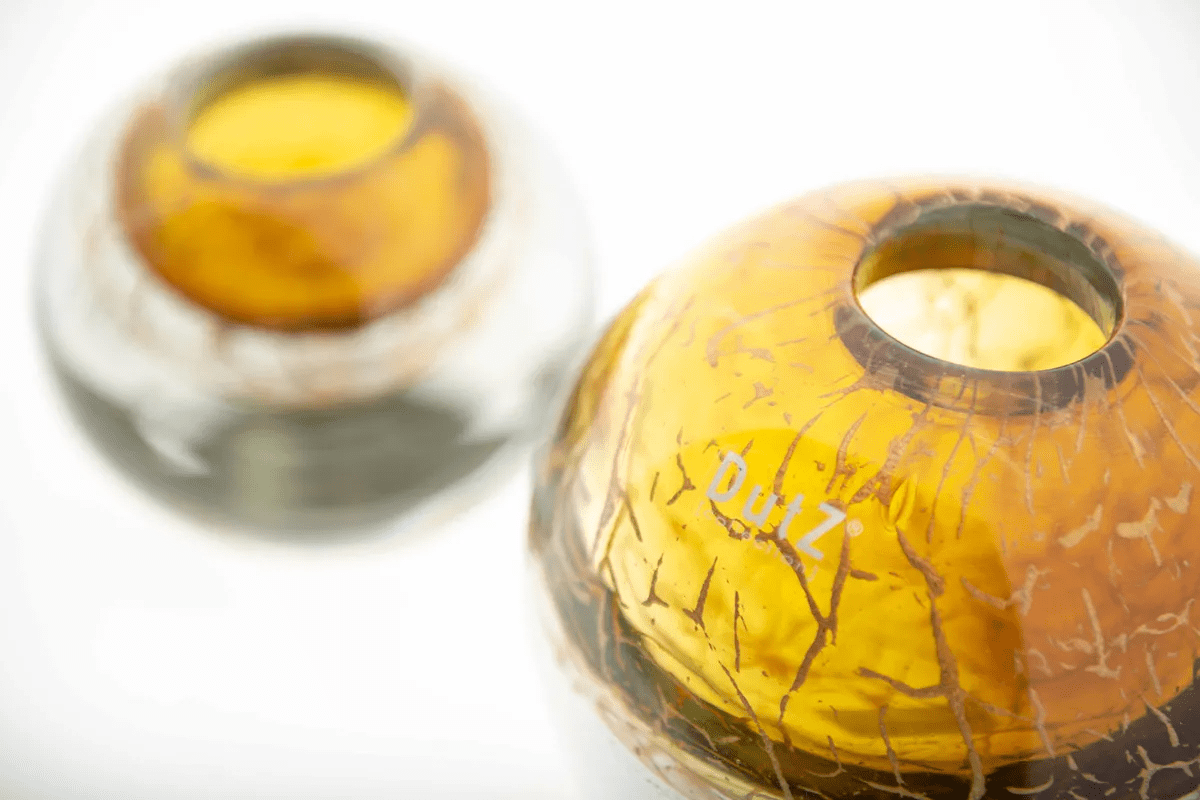 Lowlands Design ball vase in amber with cracked glass texture and rounded shape