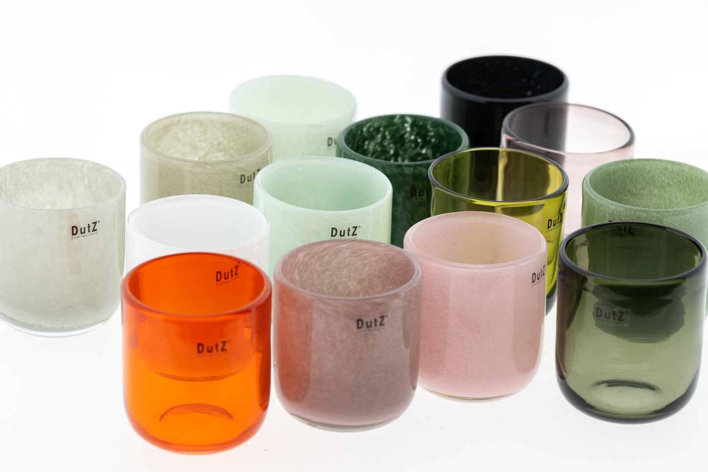 Blown glass cup candleholder set in various colours, including green, orange, and black