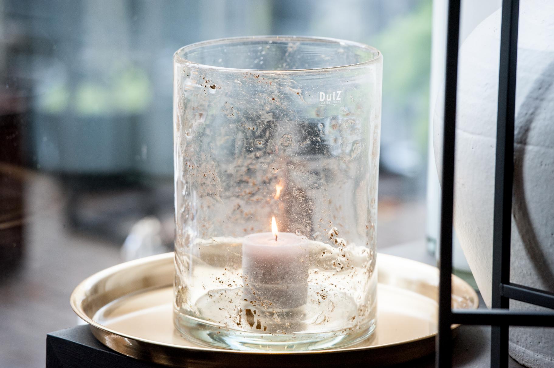 Lowlands Design candleholder mouthblown glass home with a lit candle inside on a stylish tray