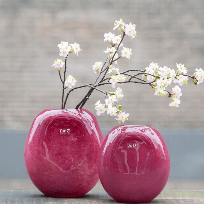 Lowlands Design red decor vase set with rounded shapes and blooming white flowers on branches