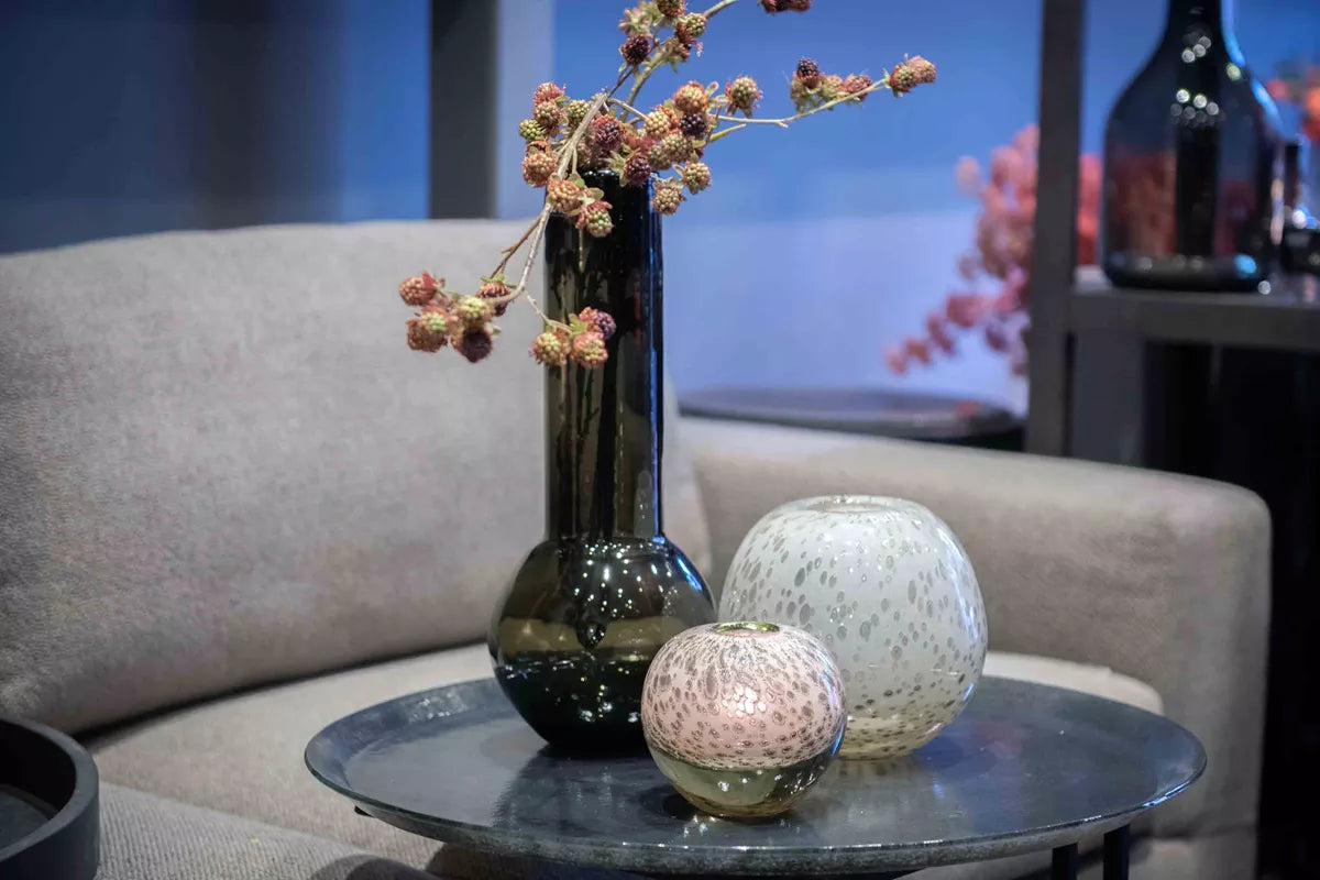 Lowlands Design glass flowervase mouthblown smoke displayed with decorative flowers on a stylish table