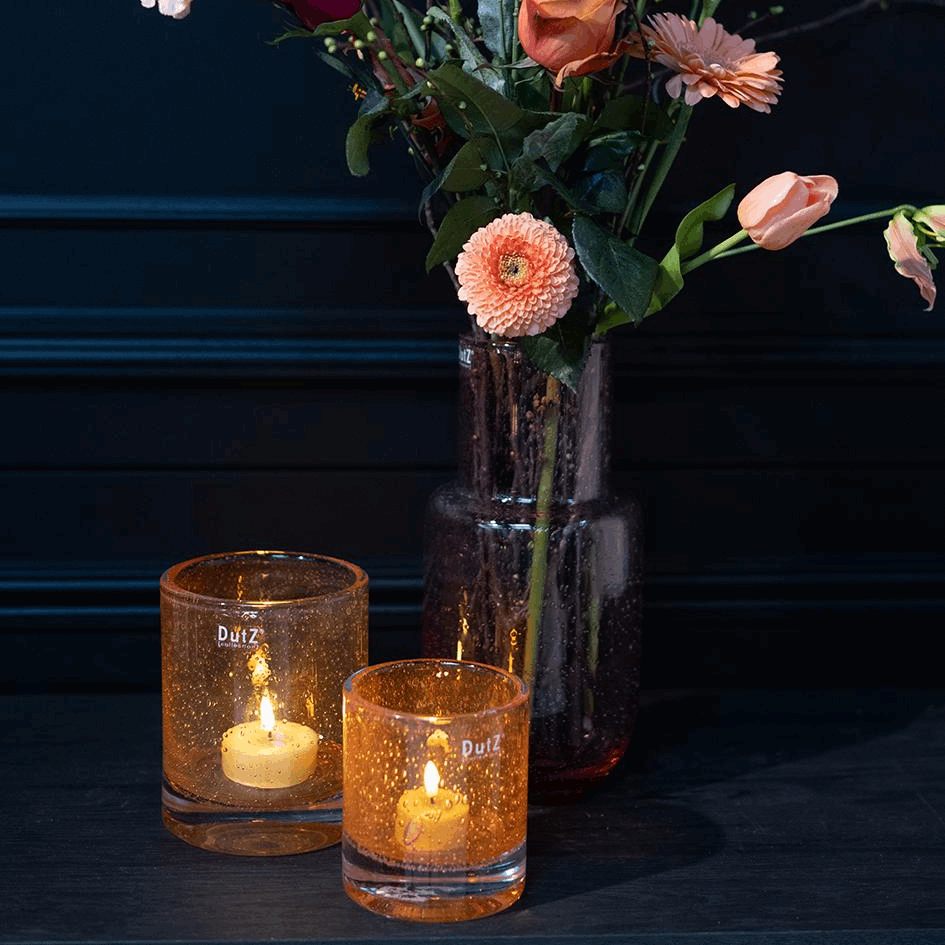 Lowlands Design glass flowervase mouthblown with vibrant flowers and candles on dark wooden table
