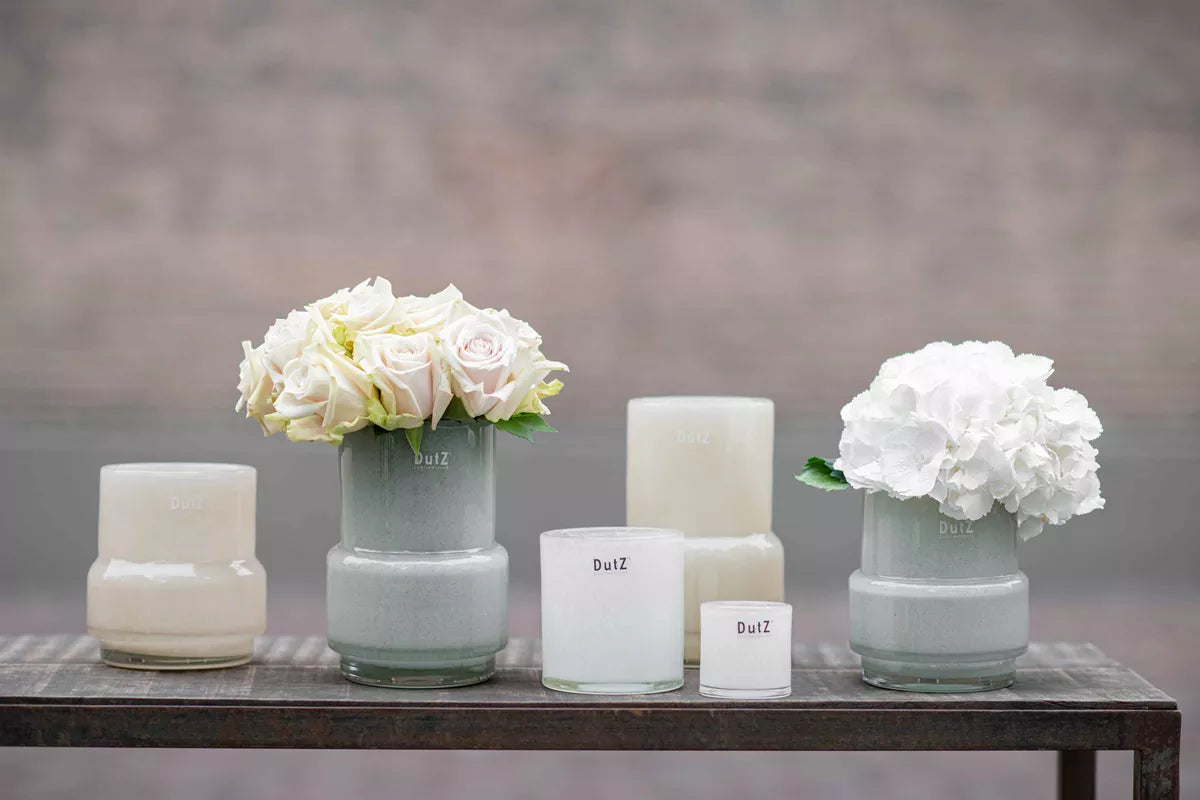 Lowlands Design glass light grey vase plant pot featuring elegant floral arrangements on a wooden table