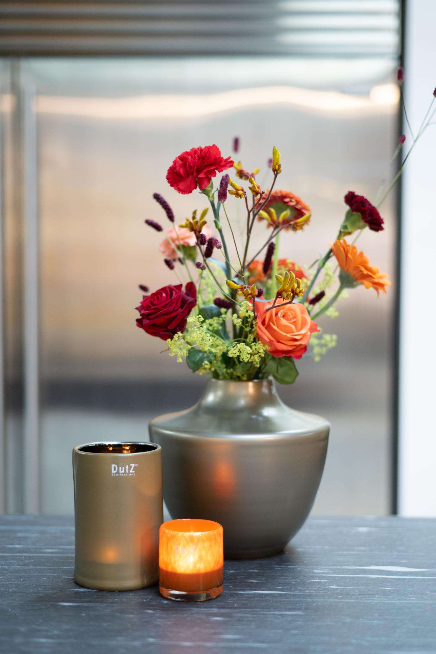 Design vase from Lowlands Design with glass mouthblown dutz featuring vibrant floral arrangement