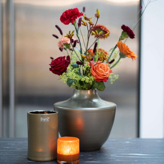 Elegant design vase by Lowlands Design made of glass mouthblown dutz, featuring vibrant floral arrangement
