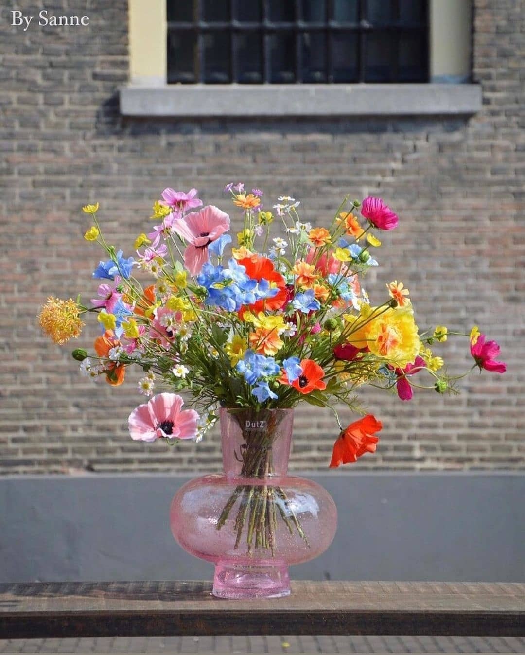 Lowlands Design Glass Posy Vase filled with a vibrant mix of colourful flowers