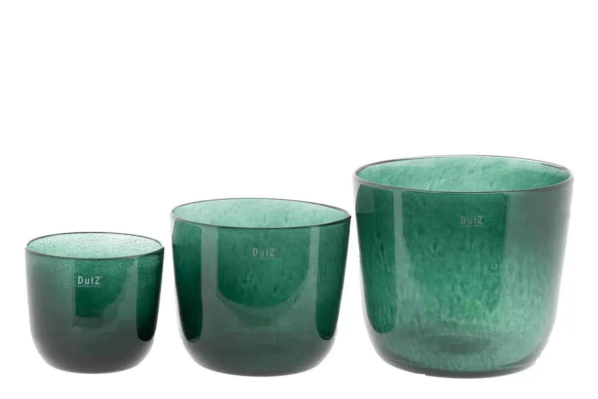Three green glass plant pots from Lowlands Design with varying sizes, perfect for stylish indoor plants