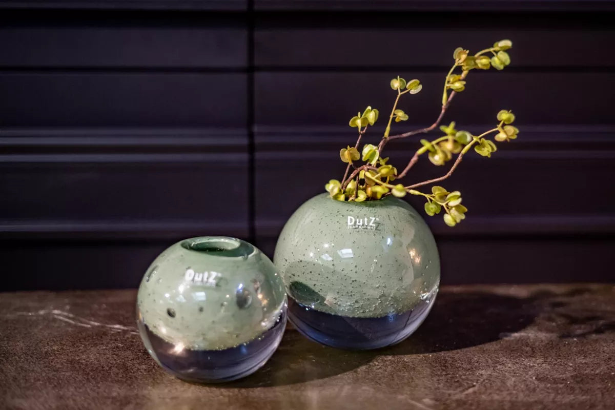Lowlands Design handmade glass ball vase for home decor set of two green speckled round vases one with sprig