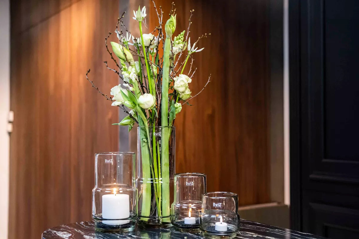 Lowlands Design luxury home decor clear glass vase with white lilies and matching glass candle holders