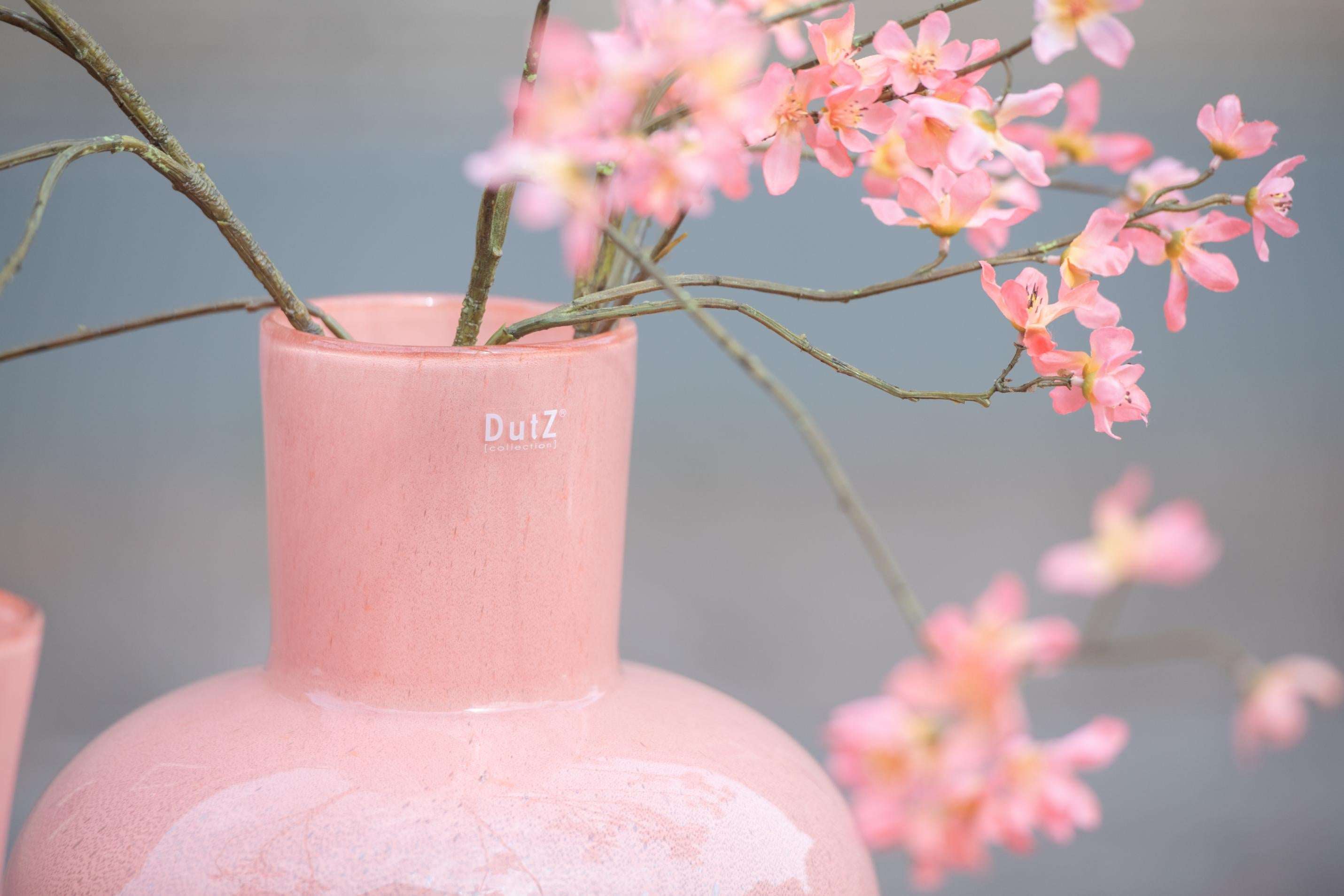 Lowlands Design mouth blown glass vase in soft pink, perfect for displaying flowers, 20cm tall.