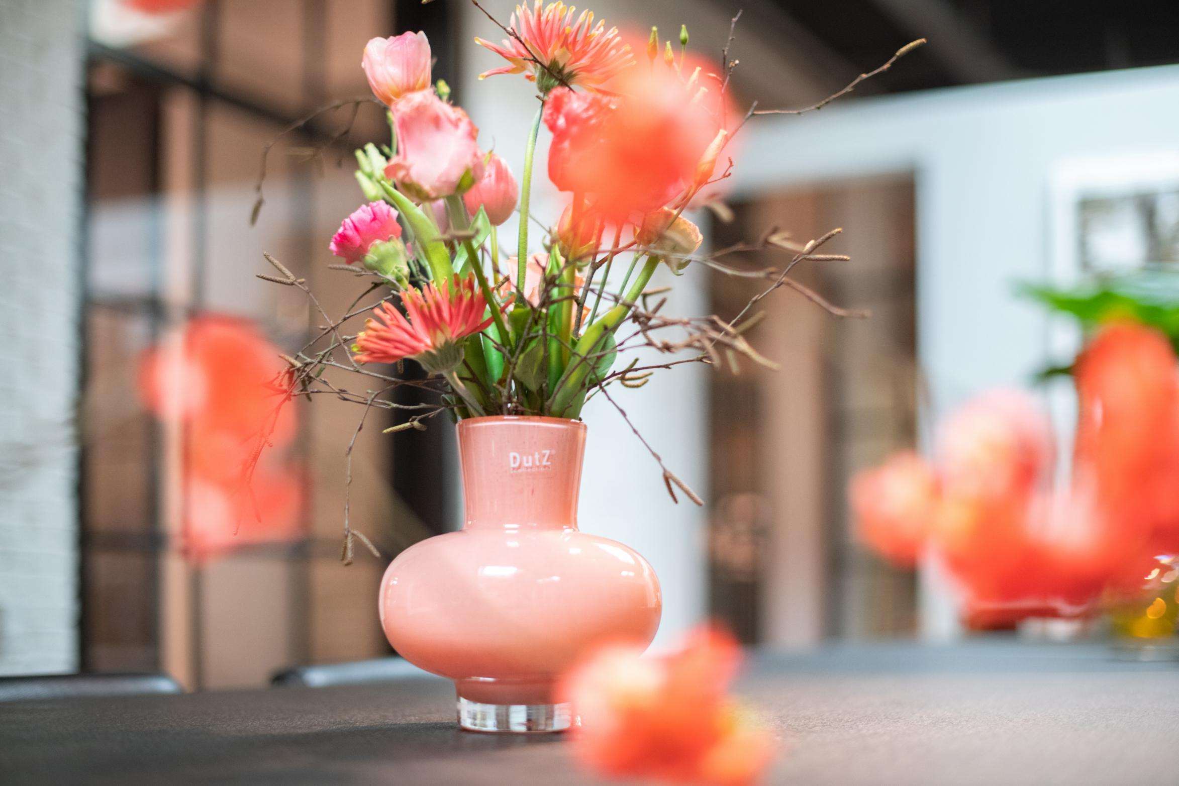 Lowlands Design pink mouth blown glass vase, designed for displaying fresh flowers with a modern aesthetic